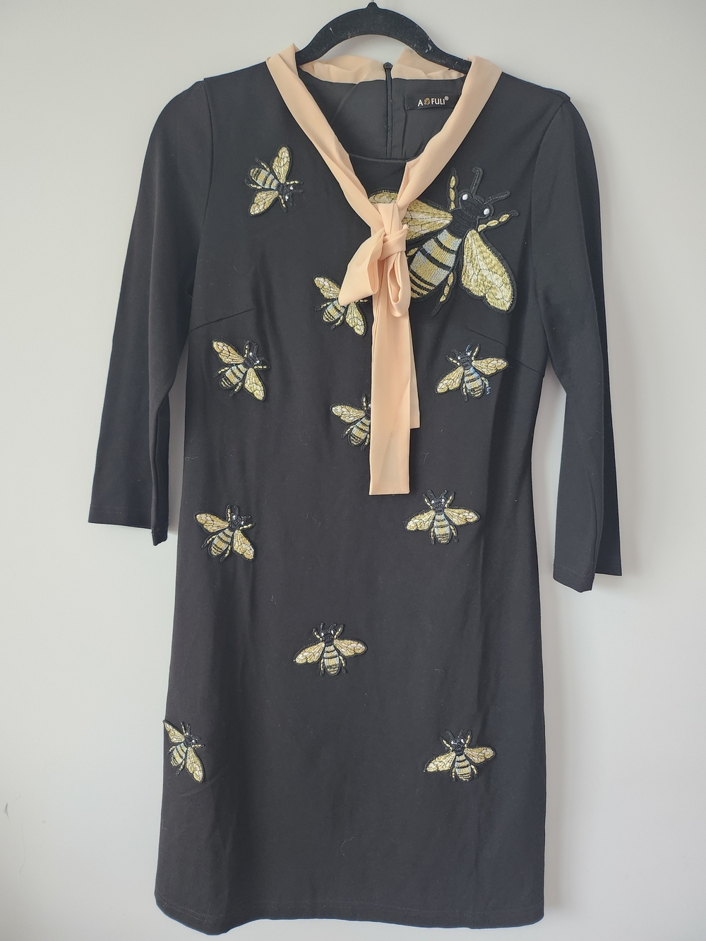 A. Folly Black Woman' Bee Embellished Dress with Cream Tie